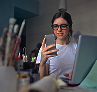 a woman looking at her mobile device