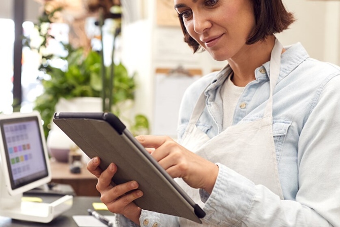 a small business owner reviewing electronic inventory