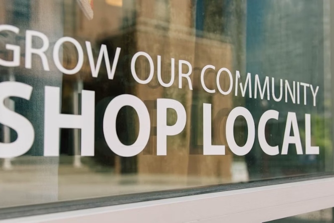 grow our community shop local window sign