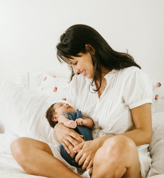 Mother with an infant child at home