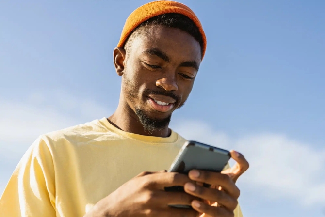 a man holding his mobile device